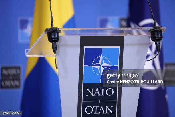 Picture taken at the NATO headquarters in Brussels shows Sweden and NATO flags before a press conference, on June 27, 2022.