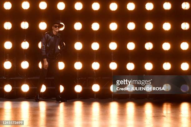 French designer Hedi Slimane acknowledges the audience at the end of the Celine fashion show during the Menswear Ready-to-wear Spring-Summer 2023...