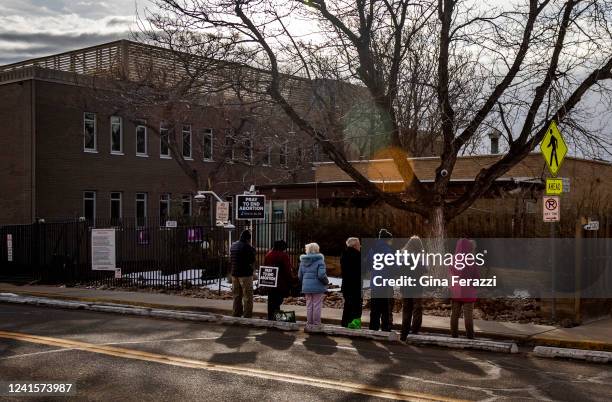 Anti-abortion protesters pray in front of Dr Warren Herns abortion clinic on February 1, 2022 in Boulder, Colorado.