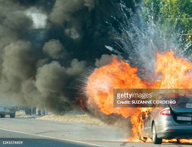 Ford Fusion hybrid vehicle explodes into flames northbound on I-35 just north of Austin, Texas, on June 25, 2022. The occupants of the car were...