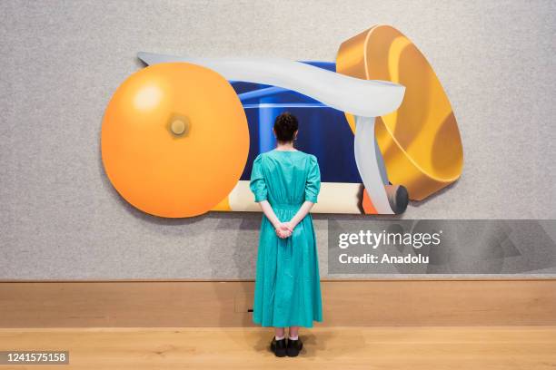 Staff member looks at a painting titled âStill Life with Blue Jar and Smoking Cigarette , 1980-1982, by Tom Wesselmann , estimate: Â£850,000 - Â£1...