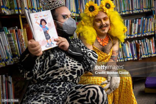 Chelsea, MA Drag queens Just JP, left, and Sham Payne read stories to children during a Drag Story Hour at Chelsea Public Library in Chelsea, MA on...