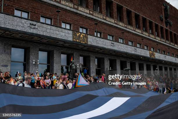 People start to gather to join a solidarity celebration in front of the city hall on June 27, 2022 in Oslo, Norway. Early on Saturday, a man fatally...