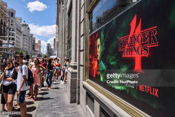People wait in a line to enter 'The Lab', Stranger Things Netflix series experience venue in Madrid, Spain on June 27th, 2022. The visit in The Lab...