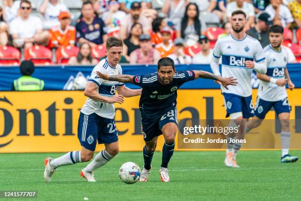DeLaGarza of the New England Revolution chases after the ball during the game between Vancouver Whitecaps and the New England Revolution at BC Place...