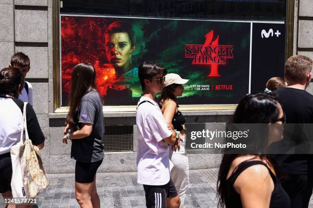 People wait in a line to enter 'The Lab', Stranger Things Netflix series experience venue in Madrid, Spain on June 27th, 2022. The visit in The Lab...