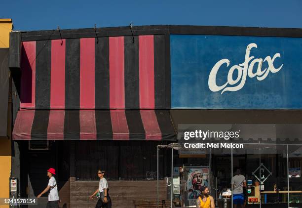 Pedestrians make their way past storefronts on Fairfax Ave. Between Melrose Ave. And Beverly Blvd., the real-life setting that inspired Amazons...
