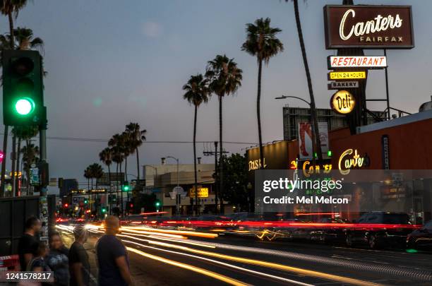 Pedestrians wait to cross the street on Fairfax Ave. Between Melrose Ave. And Beverly Blvd., the real-life setting that inspired Amazons animated...