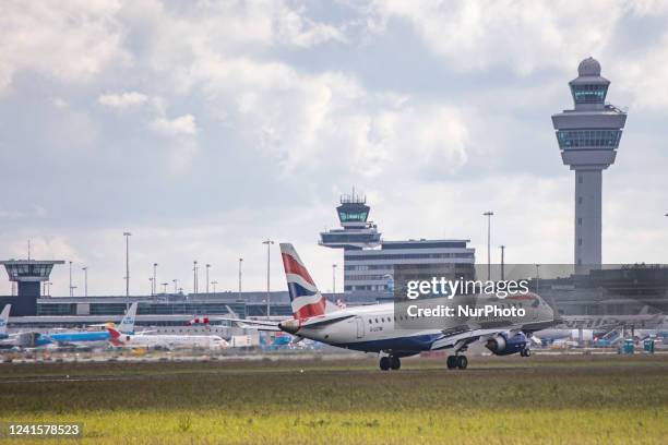 British Airways Embraer ERJ-190 aircraft as seen flying and landing at Amsterdam Schiphol Airport. The narrow-body airplane has the registration...