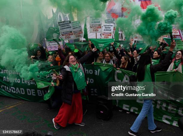 Pro-abortion rights activists shout slogans and light flares during a protest at US Embassy on June 27, 2022 in Buenos Aires, Argentina. On Friday,...