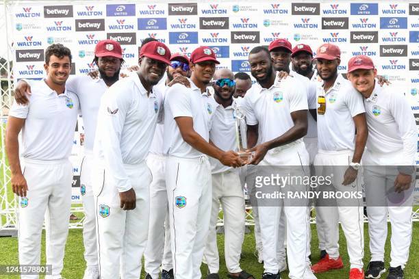 Members of the West Indies team stand for a photo with the trophy after winning on the fourth day of the 2nd Test between Bangladesh and West Indies...