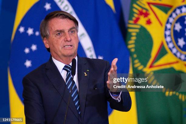 President of Brazil Jair Bolsonaro speaks during the ceremony to unveil a project for new national ID's and passports at Planalto Palace on June 27,...