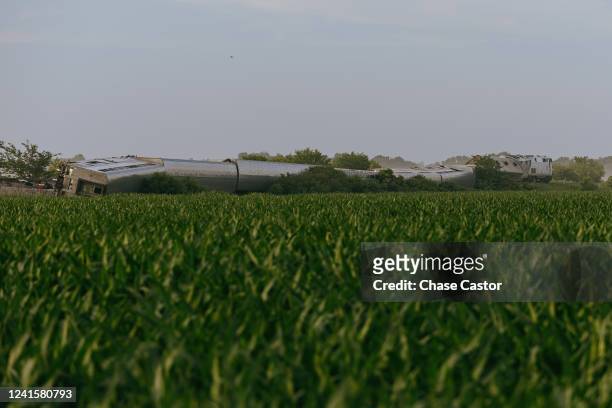 Railroad workers work at a scene where an Amtrak train derailed on June 27, 2022 in Mendon, Missouri. The train, traveling from Los Angeles to...