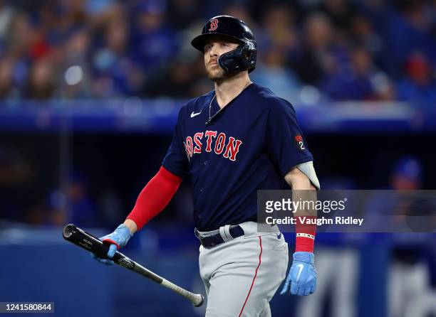 Trevor Story of the Boston Red Sox looks on after striking out in the seventh inning against the Toronto Blue Jays at Rogers Centre on June 27, 2022...