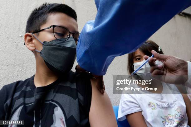 Child receives a Pfizer dose against Covid-19 disease during the mass vaccination campaign for children of 10 and 11-year olds inside the Dr. Juan...