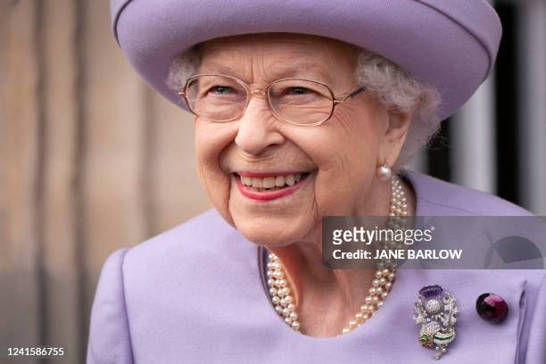 Britain's Queen Elizabeth II attends an Armed Forces Act of Loyalty Parade at the Palace of Holyroodhouse in Edinburgh, Scotland, on June 28, 2022....