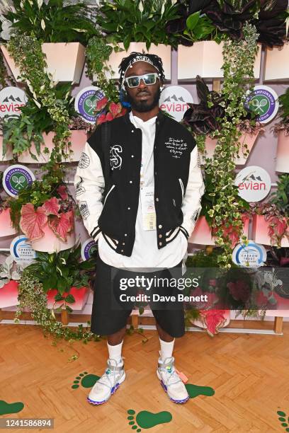 Kojey Radical attends the evian VIP Suite, certified as carbon neutral by The Carbon Trust, at Wimbledon on June 28, 2022 in London, England.