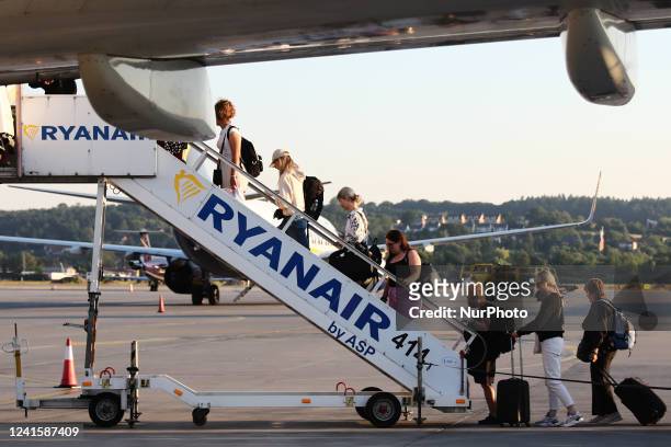 Passengers board the Ryanair Boening 737 airplane at the airport in Balice near Krakow, Poland on June 27, 2022.