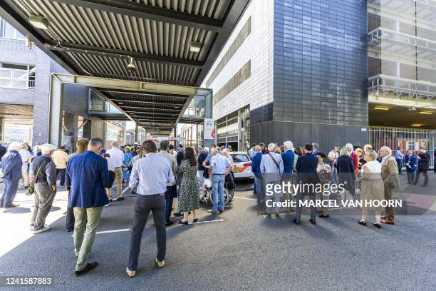 Bystanders gather outside the TEFAF Art Fair in Maastricht on June 28 following a robbery. - Armed robbers raided the TEFAF, one of the world's...