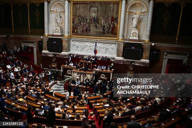 This photograph taken on June 28 shows French Members of Parliament queueing and voting for the election of the lower house President at the start of...