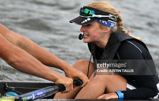 Cox shouts instructions to the team as competitors race along the River Thames at the Henley Royal Regatta in Henley-on-Thames, west of London, on...