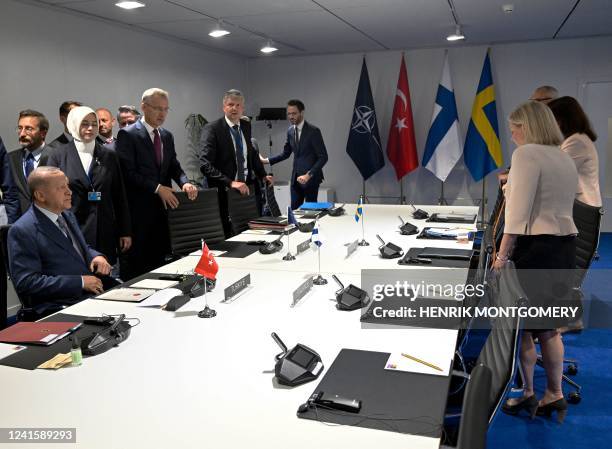 Turkey's President Recep Tayyip Erdogan , NATO Secretary General Jens Stoltenberg and Sweden's Prime Minister Magdalena Andersson take part in a...