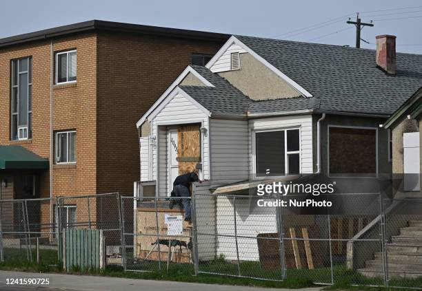 Squatter trying to enter an abandoned house in Central Edmonton.Friday, May 20 in Edmonton, Alberta, Canada.