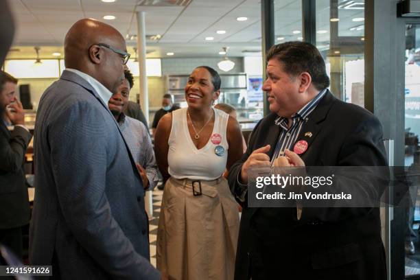 Illinois Governor J.B. Pritzker and Illinois Lieutenant Governor Juliana Stratton speak to Illinois Attorney General Kwame Raoul on Primary Day at...