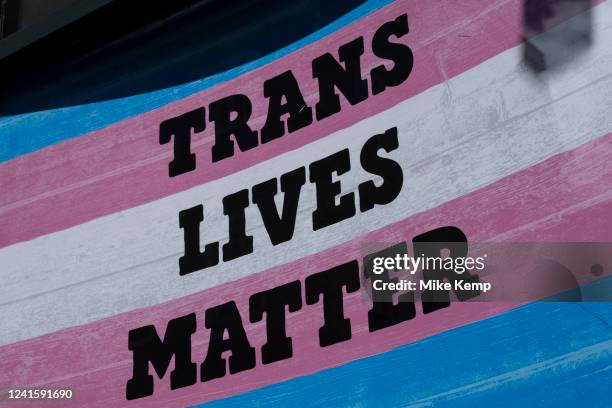 Transgender Pride flag with the slogan 'Trans Lives Matter' in Soho on 28th June 2022 in London, United Kingdom. The flag includes the rainbow flag...