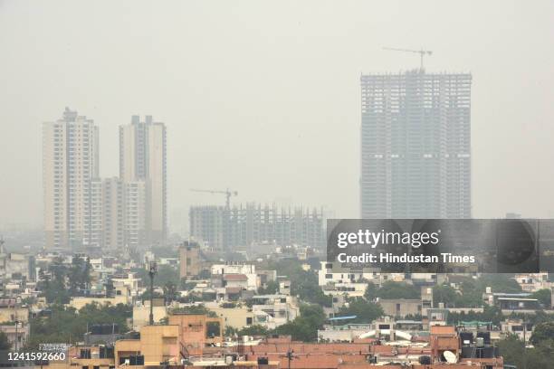 View of the skyscrapers covered in smog amid rising air pollution, on June 28, 2022 in Noida, India.