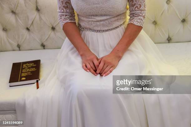Bride Elisheva Chayaa sits on the honor chair prior to a Jewish marriage ceremony held by Chabad Berlin for two Jewish Ukrainian refugees from...