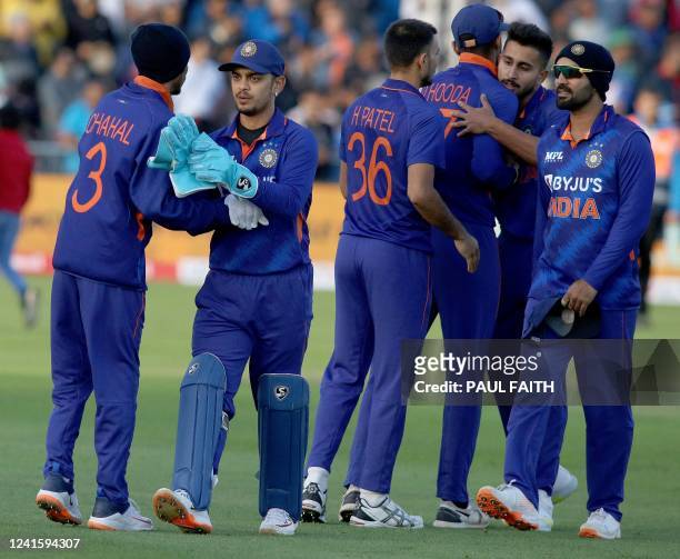 India's Yuzvendra Chahal congratulates India's Ishan Kishan as they celebrate with teammates after winning the second Twenty20 International cricket...