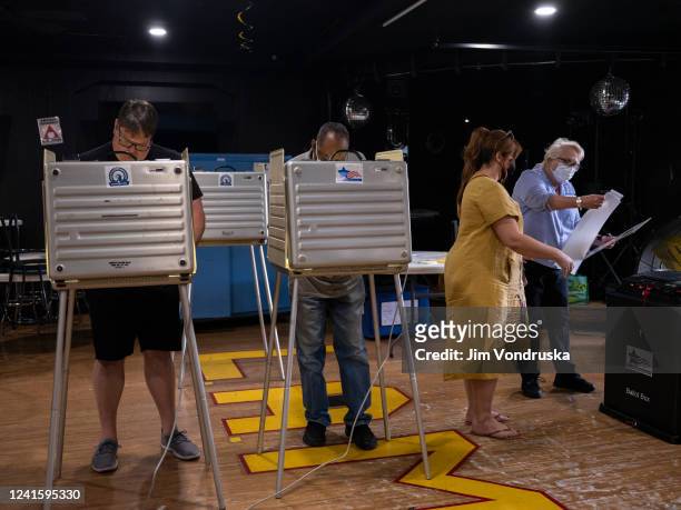 Voters cast their ballots on Primary Day at the Latin American Motorcycle Association on June 28, 2022 in Chicago, Illinois. Voters will be deciding...