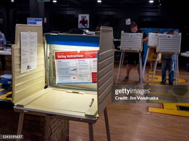 Voters cast their ballots on Primary Day at the Latin American Motorcycle Association on June 28, 2022 in Chicago, Illinois. Voters will be deciding...