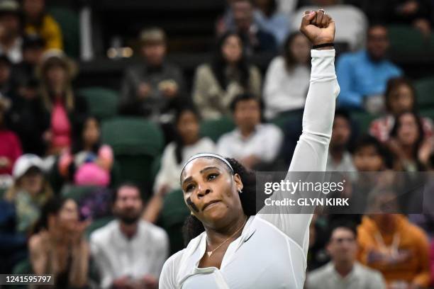 Player Serena Williams celebrates winning a point against France's Harmony Tan during their women's singles tennis match on the second day of the...