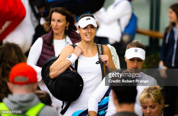 Alize Cornet on her way to the court to play Yulia Putintseva of Kazakhstan in her first round match during Day Two of The Championships Wimbledon...