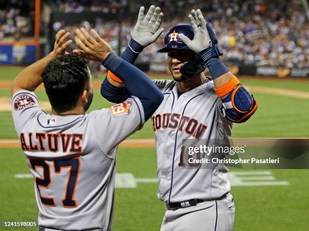 Yuli Gurriel of the Houston Astros celebrates his two-run home run with Jose Altuve in the top of the fifth inning against the New York Mets at Citi...