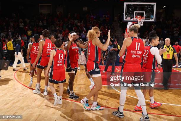 Washington Mystics high five each other after the game against the Atlanta Dream on June 28, 2022 at Entertainment & Sports Arena in Washington, DC....