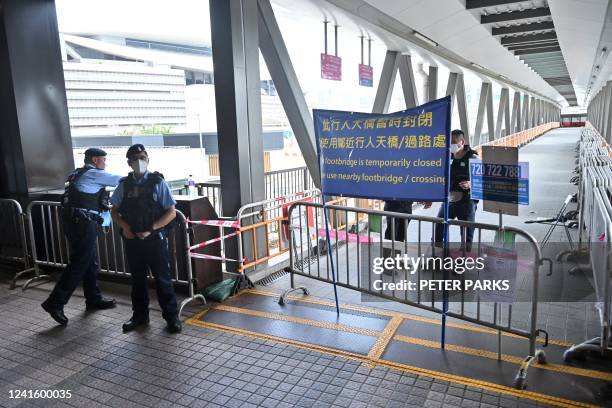 Police guard a closed footbridge in the Wanchai district of Hong Kong on June 29 close to where celebrations to mark the 25th anniversary of the...