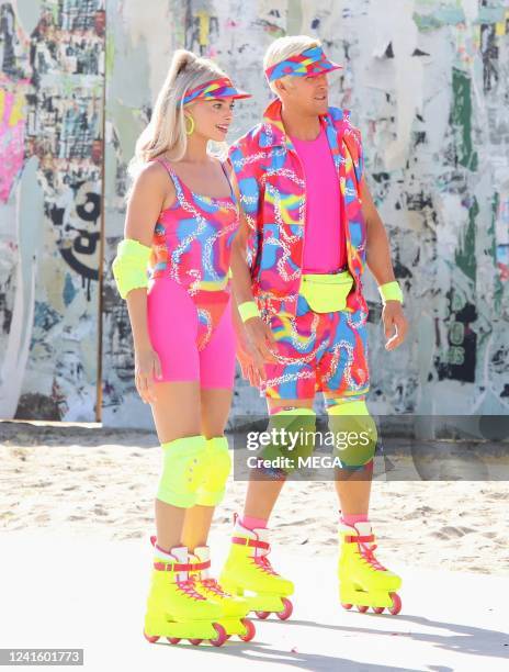 Margot Robbie and Ryan Gosling are seen rollerblading on the set of "Barbie" on June 28, 2022 in Los Angeles, California.