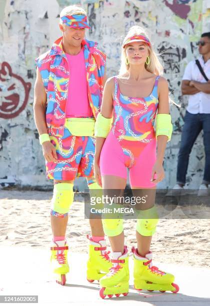 Margot Robbie and Ryan Gosling are seen rollerblading on the set of "Barbie" on June 28, 2022 in Los Angeles, California.