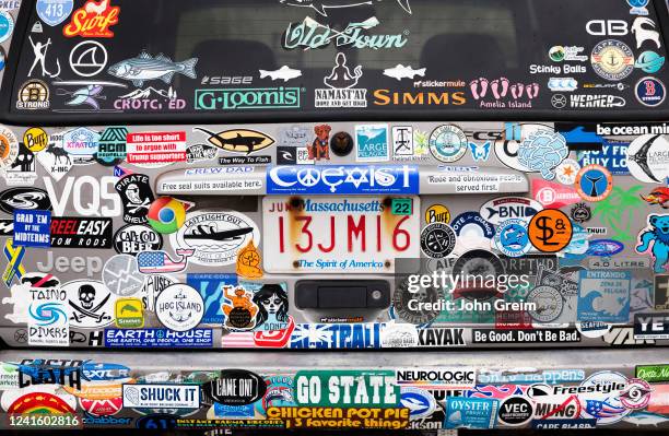 Massachusetts car with bumper stickers on display.