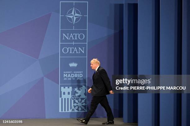 Britain's Prime Minister Boris Johnson arrives ahead of the official group photograph during the NATO summit at the Ifema congress centre in Madrid,...