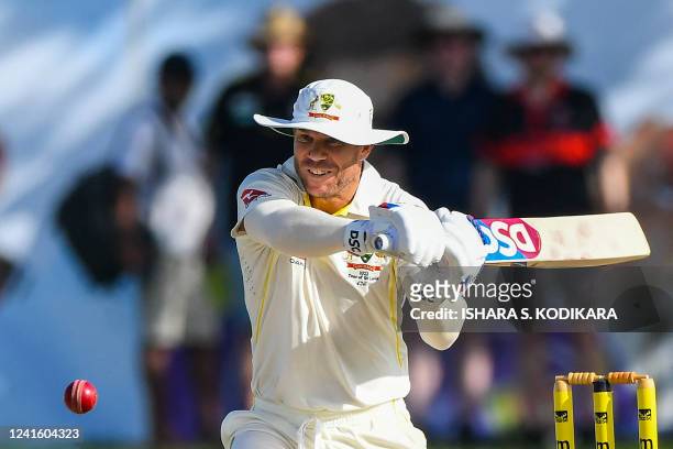Australia's David Warner plays a shot during the first day of the first cricket Test match between Sri Lanka and Australia at the Galle International...