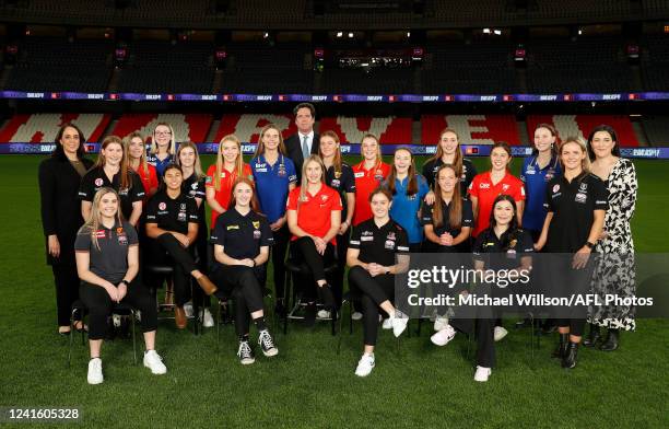 First round draft picks pose for a photo with Nicole Livingstone, Gillon McLachlan and Laura Kane during the 2022 NAB AFLW Draft at Marvel Stadium on...