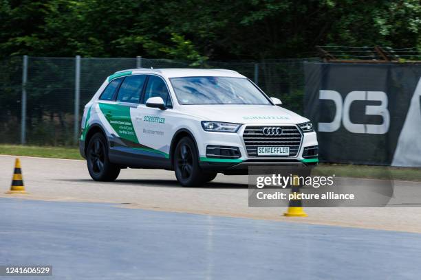 June 2022, Baden-Wuerttemberg, Rheinmünster: A Schaeffler test vehicle drives along a test track. The Schaeffler company holds its so-called...
