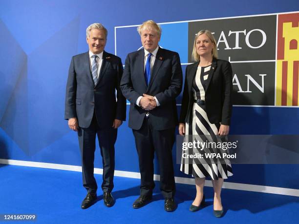 Prime Minister Boris Johnson greets Swedish Prime Minister Magdalena Andersson and Finnish President Sauli Niinisto ahead of a meeting during the...