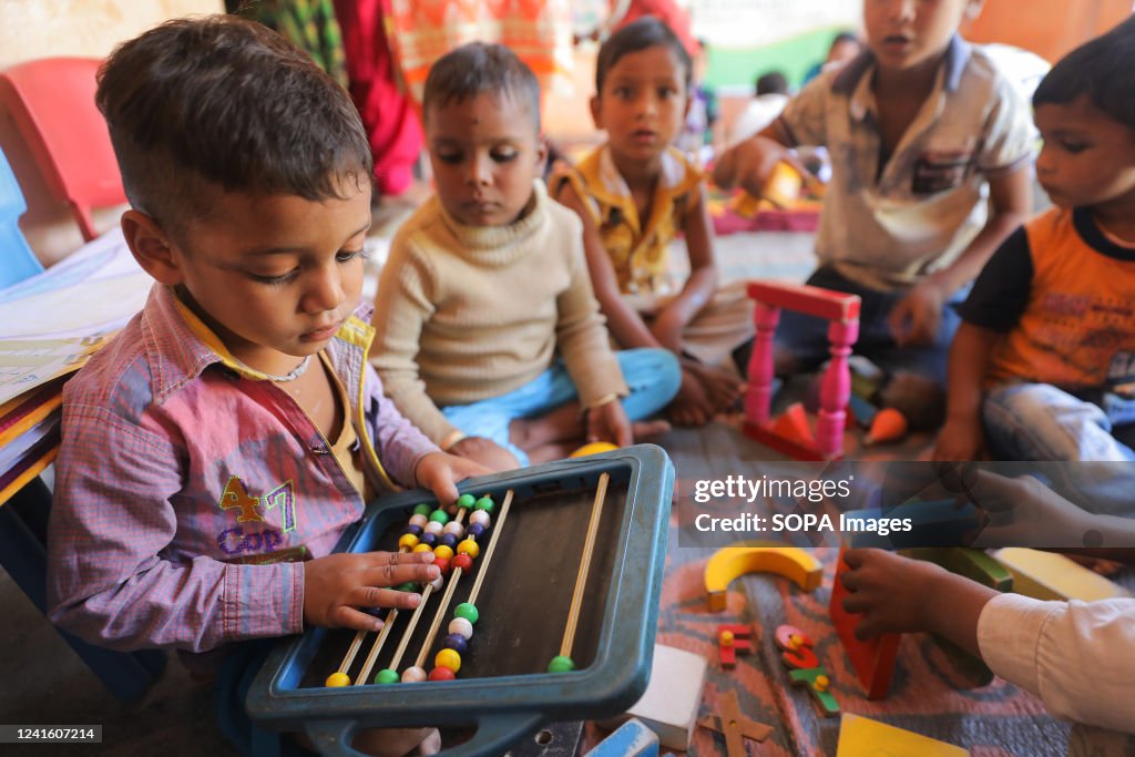 A child uses an abacus at a government school in Himachal...