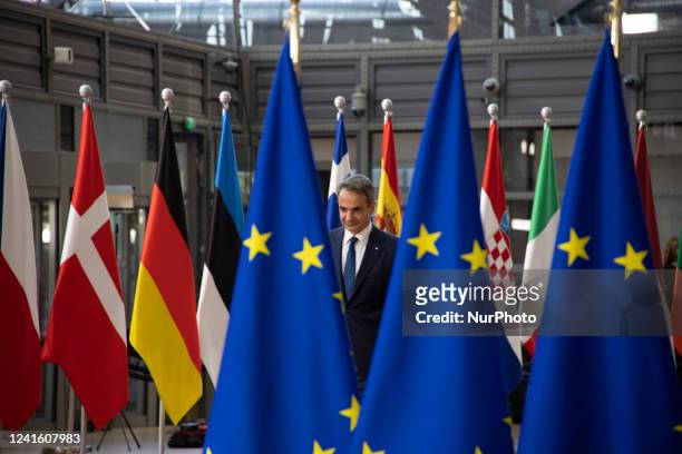 Kyriakos Mitsotakis Prime Minister of Greece as seen arriving to the European Council summit next to the European flags and flag of Europe and doing...