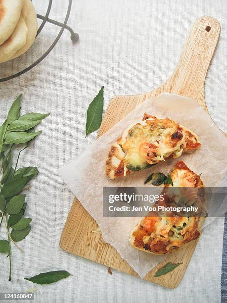 spicy thai naan pizza - naan stock pictures, royalty-free photos & images